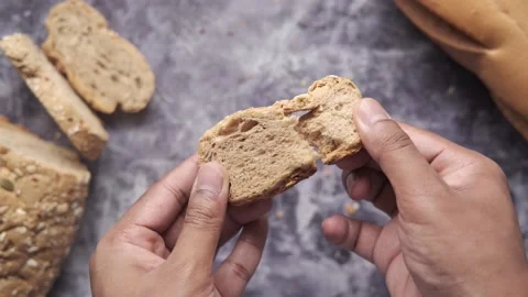 Holding slice of baked bread close up Stock Footage 154736749