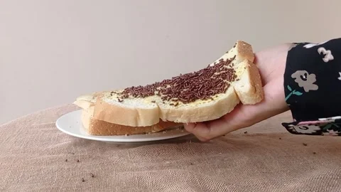 Holding a slice of bread on a hand Stock Footage 146256910