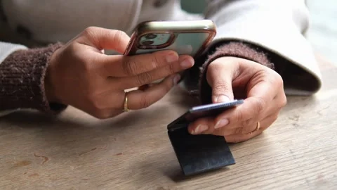 Holding smart phone while scan the Qr code for the menu at a cafe Stock Footage 328619348