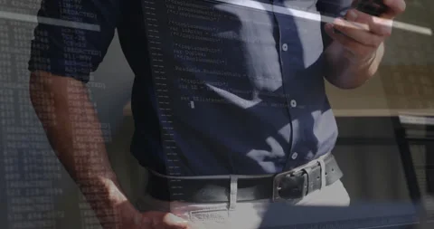 Holding smartphone with computer code overlay, person exploring animation in Stock Footage 304015627