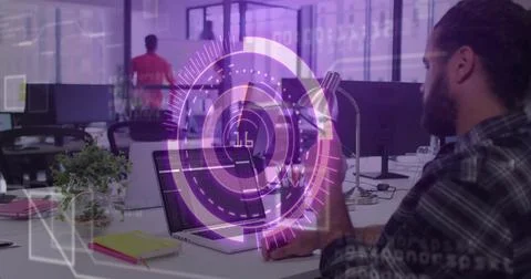 Holding smartphone, developer coding on laptop in modern office with digital 스톡 사진