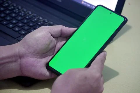 Holding smartphone Stock Photos