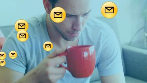 Holding smartphone, Vneck man checking mail, sipping red mug on sofa, envelopes Stock Footage 332956271