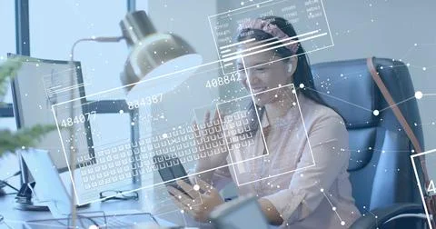 Holding smartphone while analyzing data overlays, woman wearing pink blouse, Stock Photos