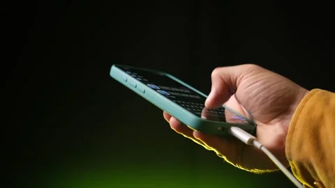 Holding a Smartphone While Charging Close-Up Stock Shot Stock Footage 318168346