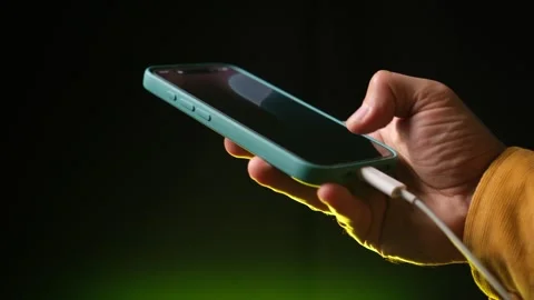 Holding a Smartphone While Charging Close-Up Stock Shot Stock Footage 318168347