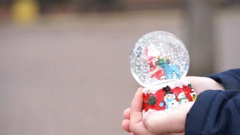 Holding snow globe Stock Footage 98286002
