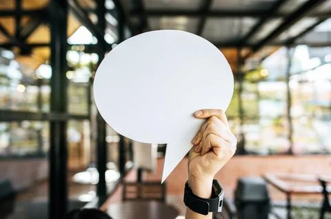 Holding speech bubble oval in cafe Stock Photos