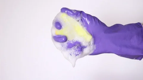 Holding sponge with white foam Vídeos de archivo 97864647