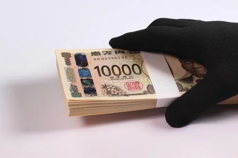 Holding a stack of bills in black glove Stock Photos