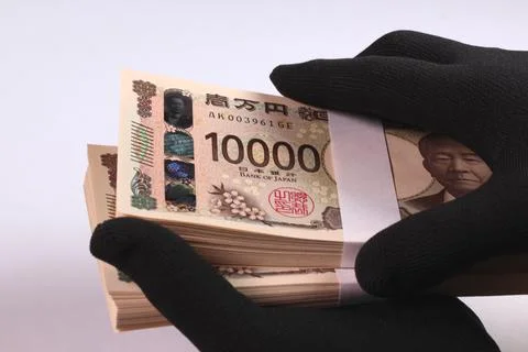 Holding a stack of bills in black gloves Stock Photos
