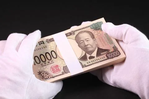 Holding a stack of bills in white gloves Stock Photos