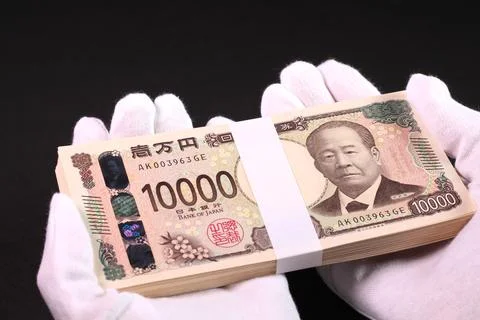 Holding a stack of bills in white gloves Stock Photos