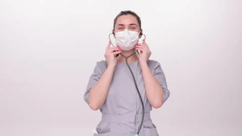 Holding a stethoscope, preparing to use it Stock Footage 276548480