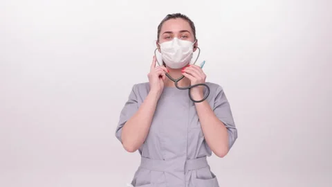 Holding a stethoscope, preparing to use it Stock Footage 276549142