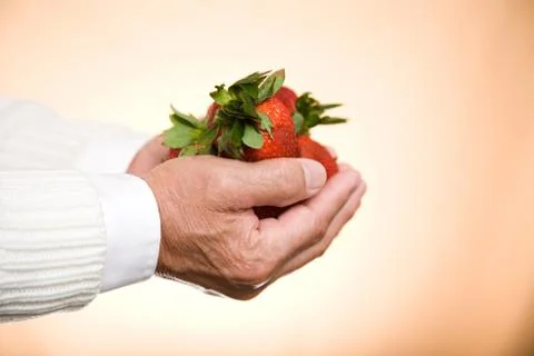 Holding strawberries Stock Photos