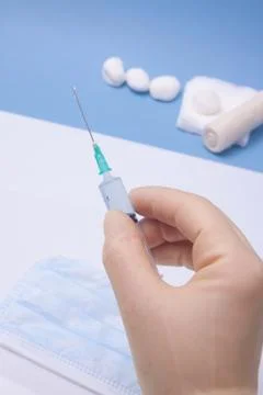 Holding Syringe Stock Photos