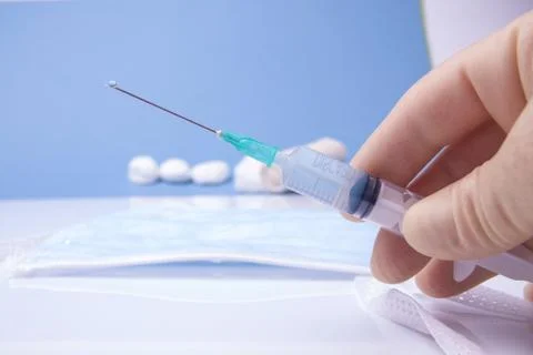 Holding Syringe Stock Photos