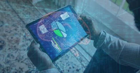 Holding tablet, analyst in suit using holographic data overlays in living room, Stock Photos