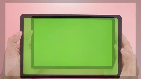 Holding tablet both hands in green-screen Stock Footage 161608448