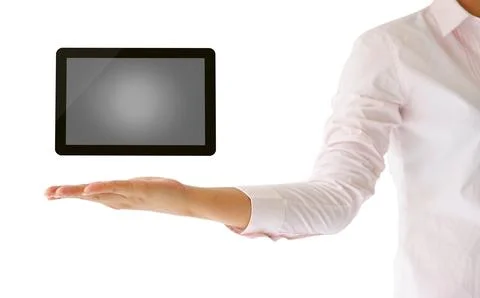 Holding tablet computer in his hand on white background Stock Photos