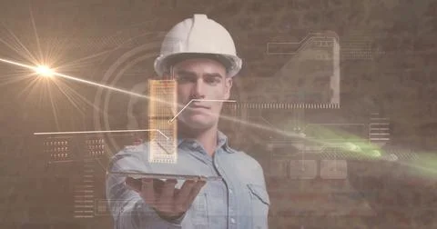 Holding tablet, denim-clad engineer wearing white helmet projecting 3D model in 스톡 사진