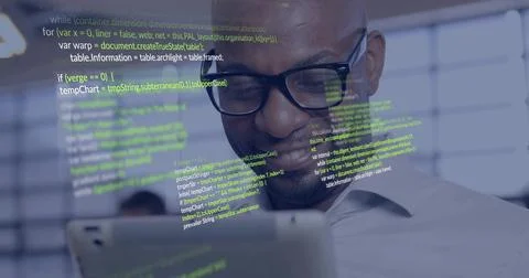 Holding tablet, developer wearing shirt analyzing projected code inside office, Stock Photos