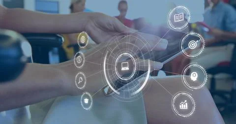 Holding tablet, foreground hands tapping screen at meeting room wearing skirt Stock Photos