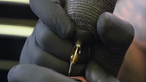 Holding A Tattoo Gun As It Pierces The Skin Video stock 308188773
