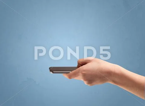 Holding telephone device from profile Stock Photos