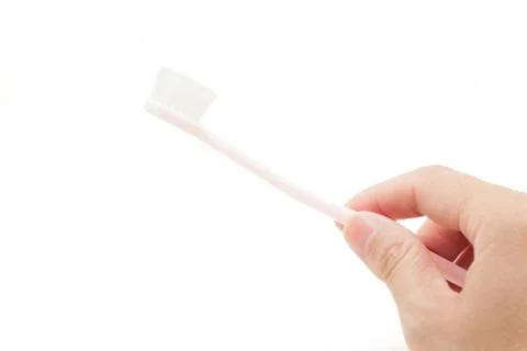 Holding a toothbrrush by hand Stock Photos