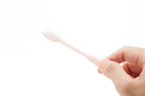 Holding a toothbrrush by hand Stock Photos