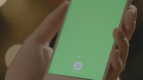 Holding Touchscreen Device, Close-up of female hands using a smart phone. Video stock 86493512