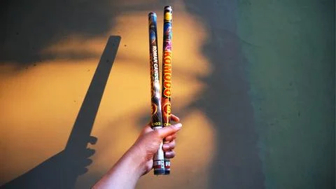 Holding two firecrackers Stock Photos