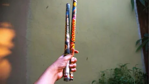 Holding two firecrackers Stock Photos