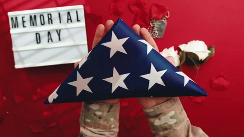 Holding USA Flag Folded Into A Triangle Stock Footage 241220062