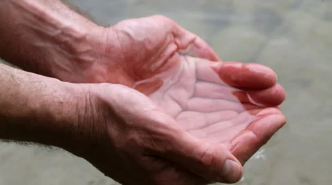 Holding water in cupped hands Stock Footage 65743272