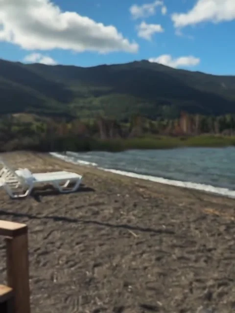 Holding a White Coffee Mug Overlooking a Scenic Lake and Mountains Stock Footage 342263863