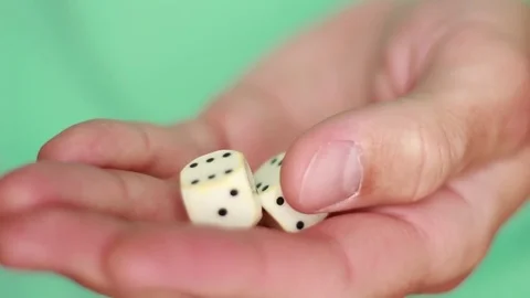 Holding white dice closeup 動画素材 75827458