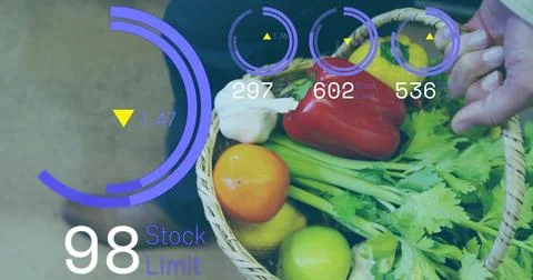 Holding wicker basket, man checking HUD in market with celery red pepper garlic, Stock Photos