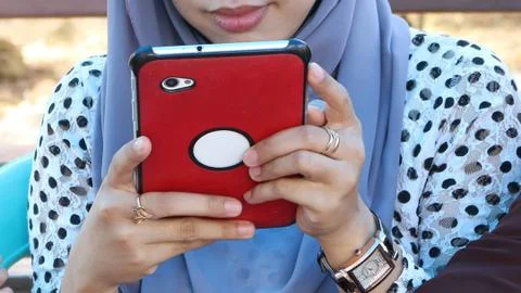 Holding a widescreen smartphone Stock Photos