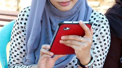 Holding a widescreen smartphone Stock Photos