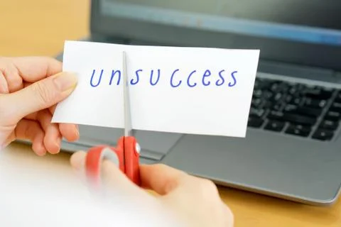 Holds card with text unsccess on computer Stock Photos