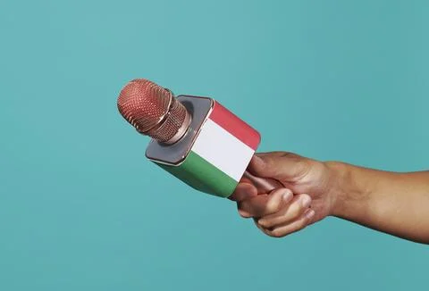 Holds a microphone patterned with the italian flag Stock Photos