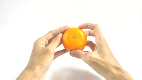 Holds An Orange Stock Footage 296723436