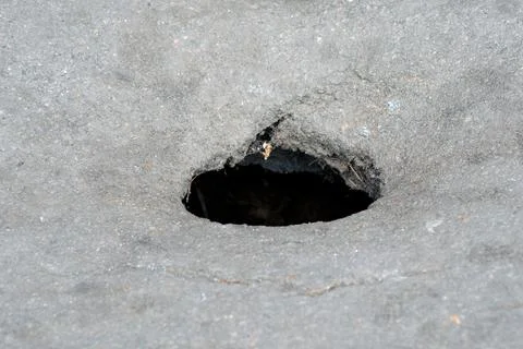 A hole in the asphalt. Stock Photos