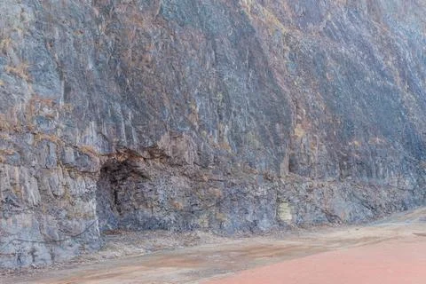Hole blasted into side of mountain. Stock Photos