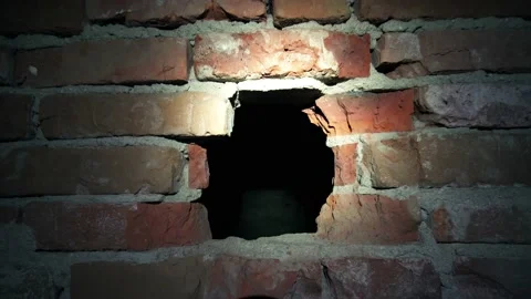 Hole in Brick Wall with Light Stock Footage 199488771