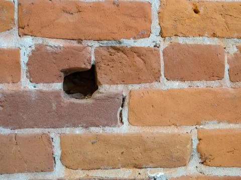 Hole in a brick wall Stock Photos
