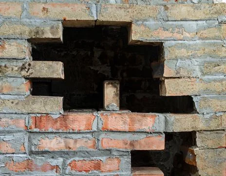 Hole in brick wall Stock Photos